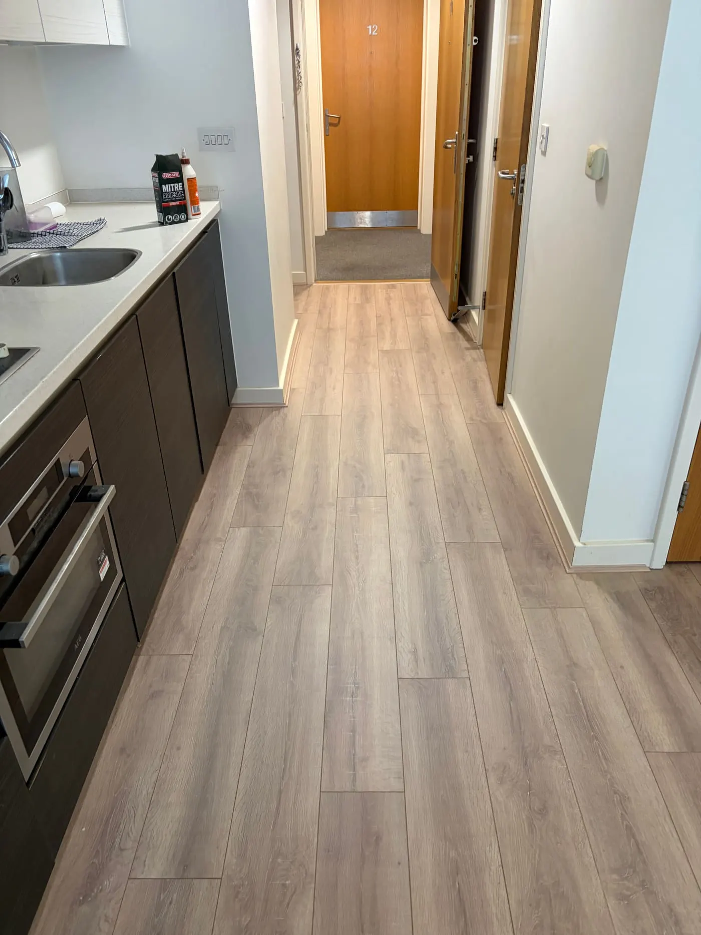 LVT luxury vinyl plank flooring in a kitchen hallway