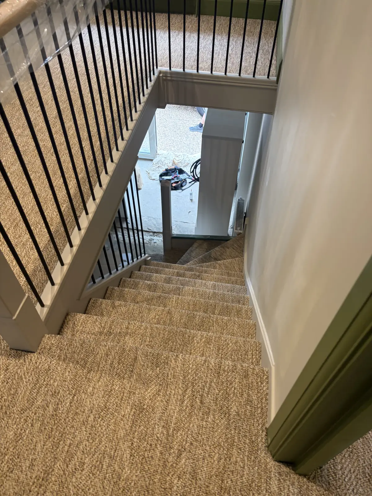 Natural loop carpet installed down a residential staircase