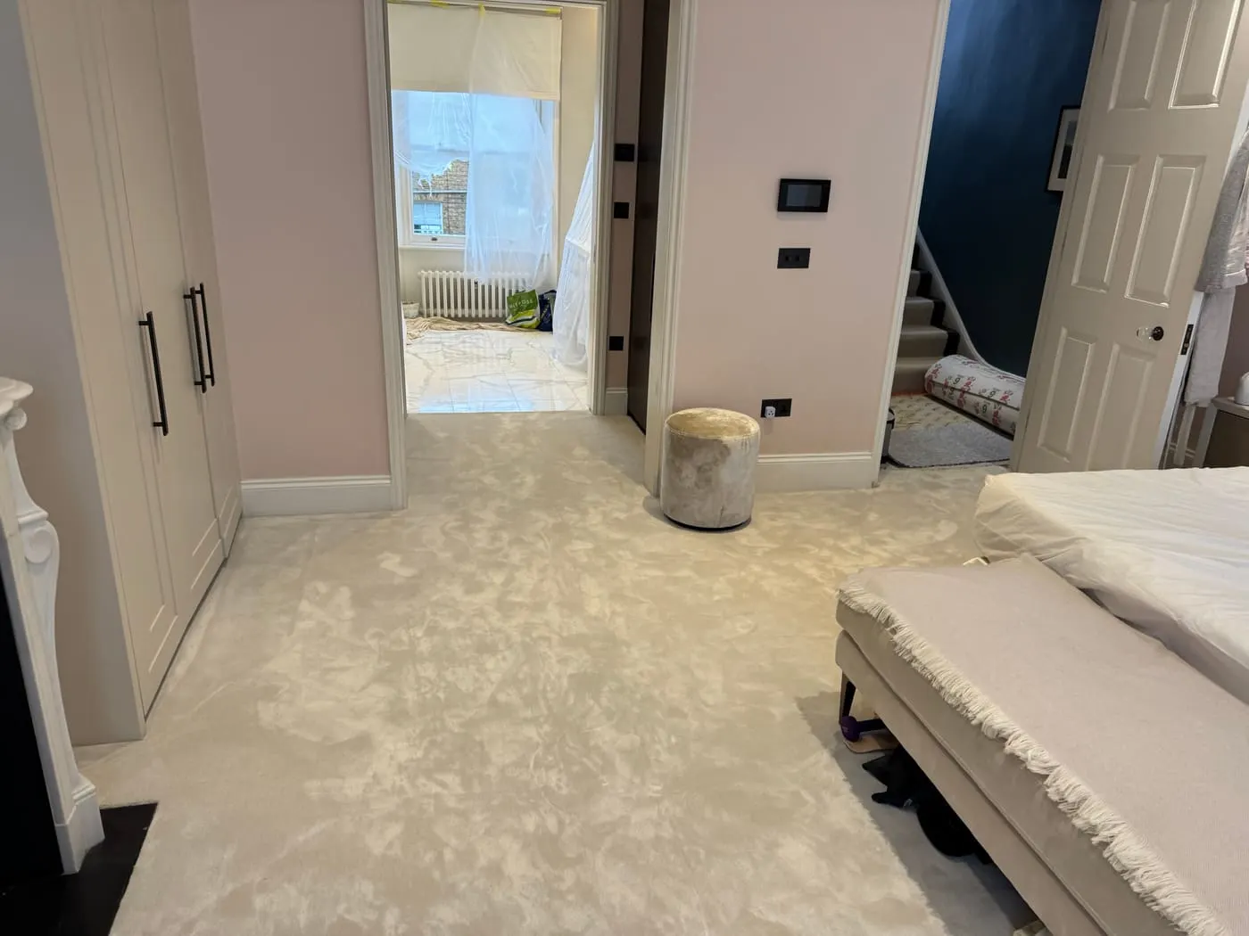 Neutral fitted carpet across an open-plan bedroom and landing